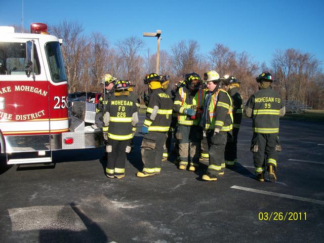 Probationary FF's Performing Extrication And Car Fire Training